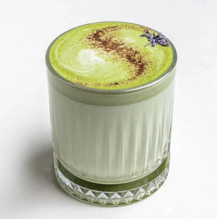 Iced matcha latte in a ribbed glass